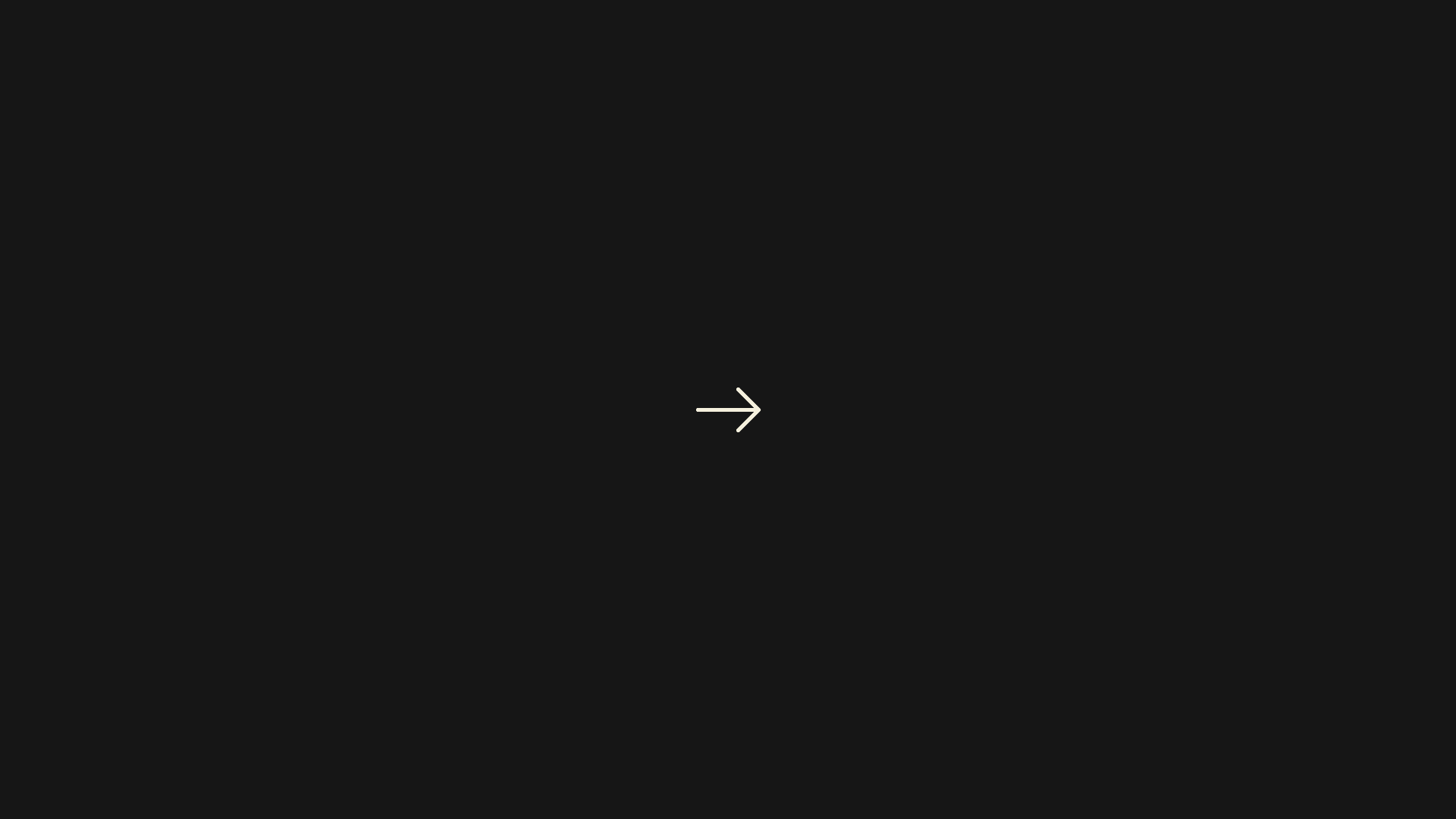 A small right-pointing arrow on a dark background